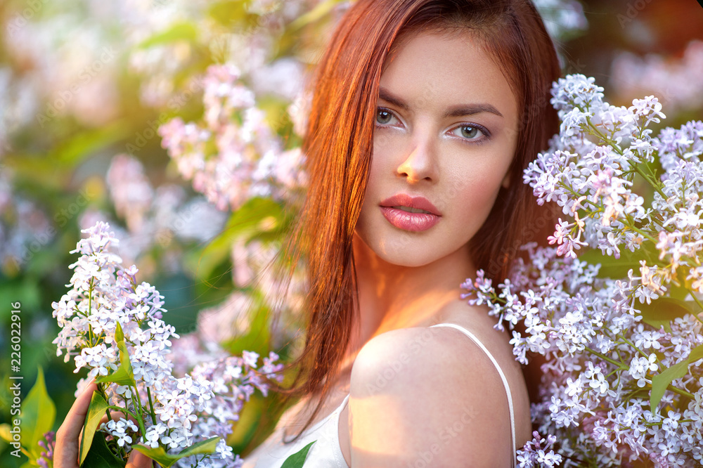 Pretty young woman posing outdoors in nature.