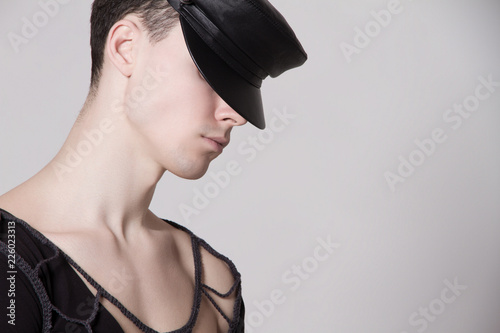Beautiful strong face male model in fashion cloathes on white isolated font background photo