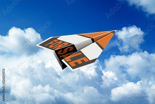 Flying paper plane with the words for sale