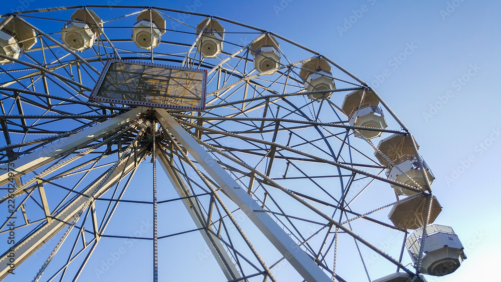 ferris wheel with the blue sky in the background ferris wheel with the blue sky in the background