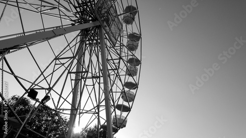 ferris wheel in black and white at sunset