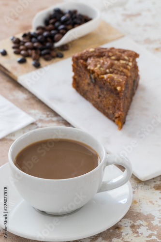 carrot cake with coffee on white