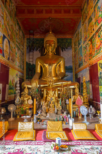 Altar and many golden Buddha statues inside of decorative Wat Mixai (Mixay) ("Temple of Victory") in Vientiane, Laos.