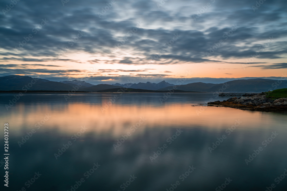 View of the fjord from Tromso on the island of Tromsoja, Norway during sunset