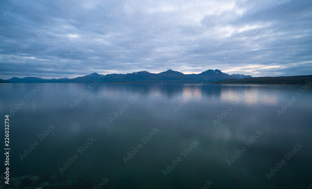 View of the fjord from Tromso on the island of Tromsoja at dusk, Norway