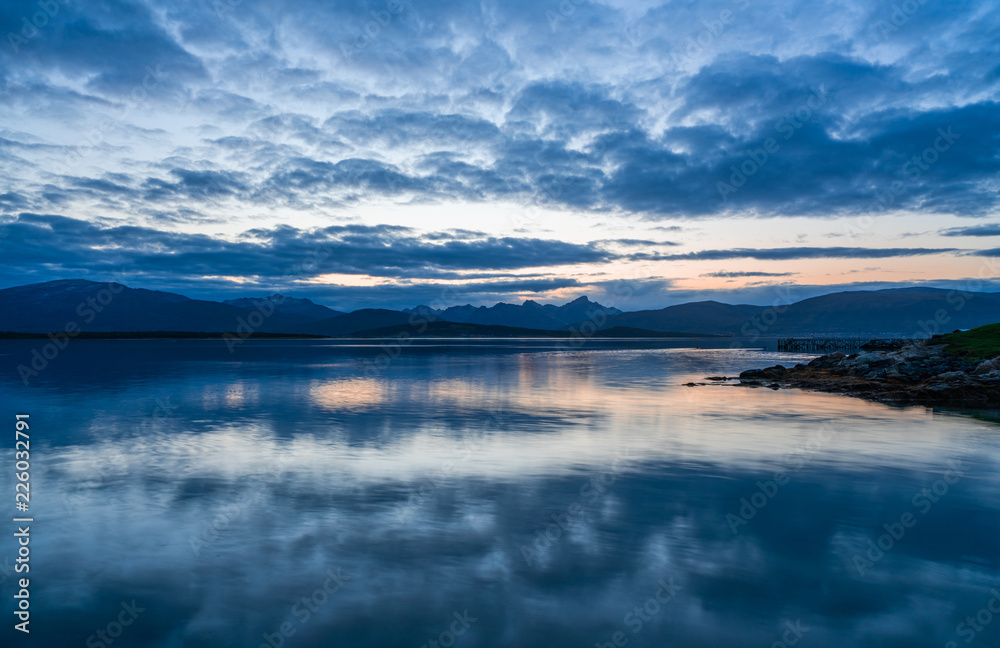 Obraz premium View of the fjord from Tromso on the island of Tromsoja, Norway during sunset