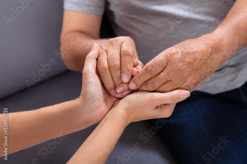 Daughter Holding Her Father's Hand