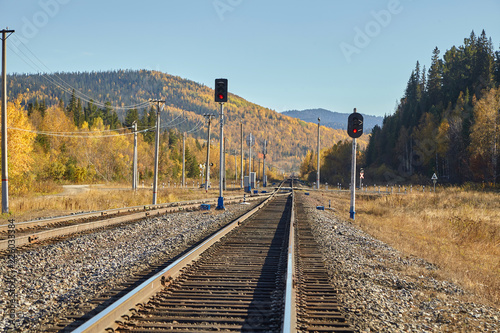 Railway and railwal lights in the mountains. Autumn landscape. photo