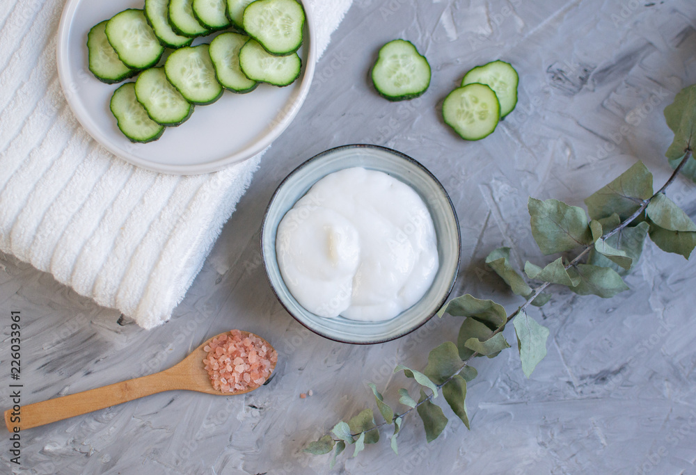 Cosmetic cream, face mask, scrub, cucumber, white bath towel, beauty concept skincare organic aroma SPA therapy Cosmetic cream, face mask, scrub, cucumber, white bath towel, beauty concept skincare organic aroma SPA therapy
