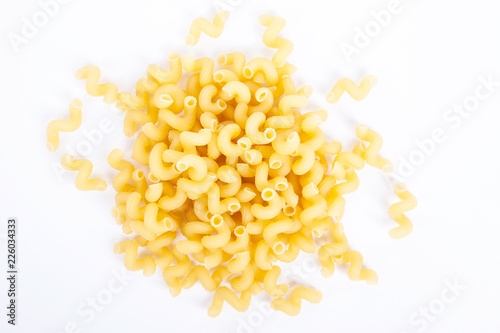 Stack of pasta or amorini on a white background. Top view.