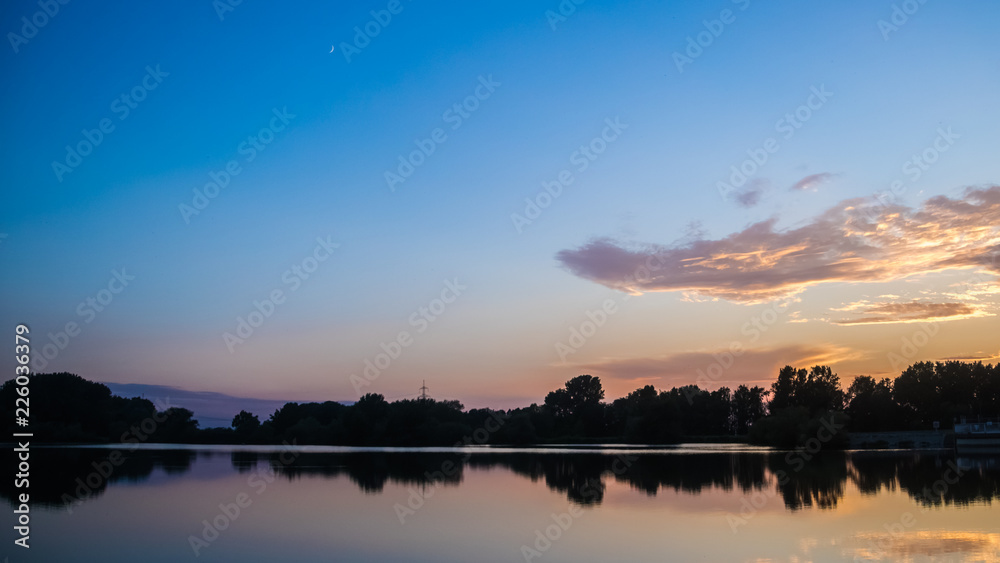 Beautiful sunset with reflections near Plattling - Isar - Bavaria - Germany Beautiful sunset with reflections near Plattling - Isar - Bavaria - Germany
