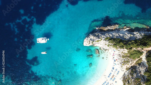 Aerial drone photo of tropical exotic caribbean paradise vegetated island with blue lagoon turquoise sea and sail boats