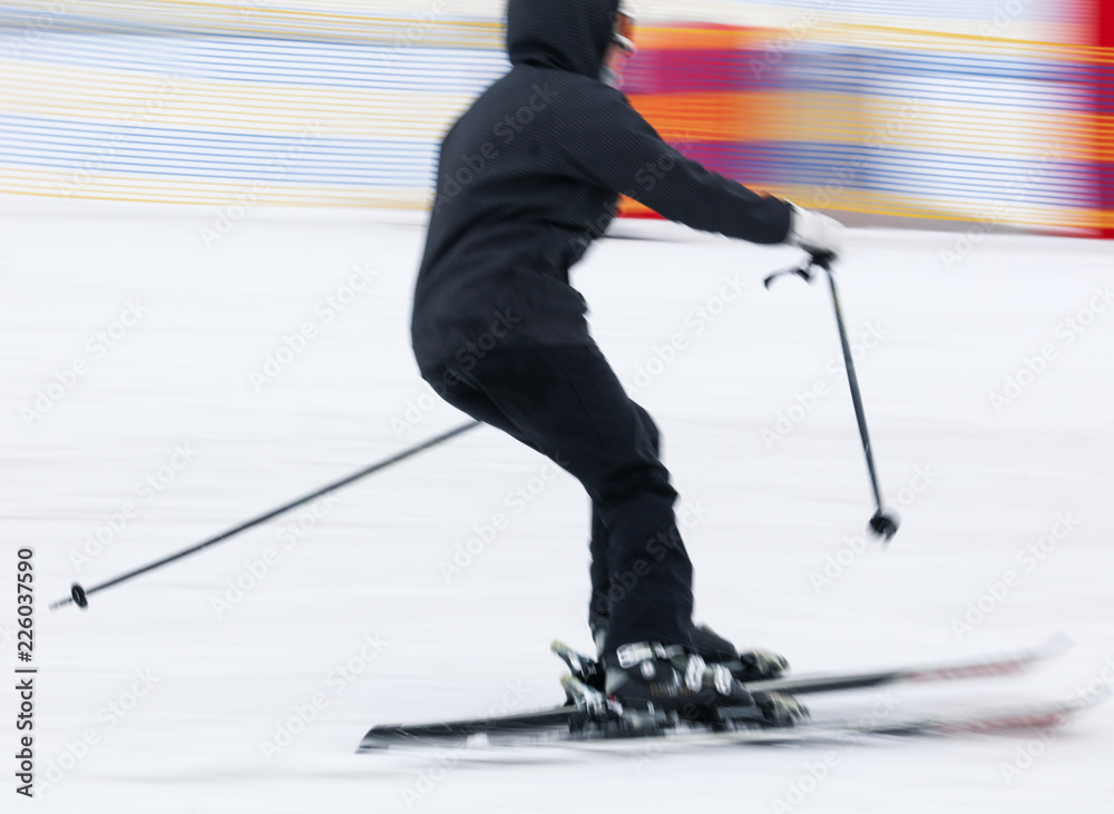 Obraz premium Girl skiing from the mountain in winter