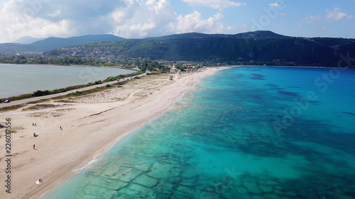 Fototapeta Naklejka Na Ścianę i Meble -  Aerial bird's eye view photo taken by drone of tropical white sandy beach with turquoise clear waters