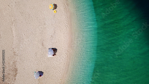 Aerial drone photo of tropical caribbean bay with white sand beach and beautiful turquoise and sapphire clear sea