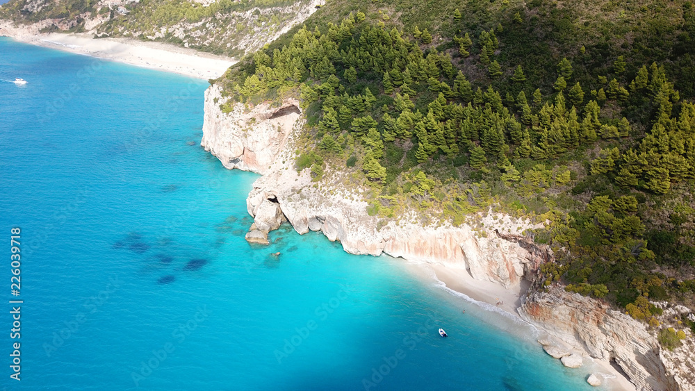 Aerial drone photo of iconic paradise beach of Kathisma with white rock steep cliff and emerald clear sea, Lefkada island, Ionian, Greece