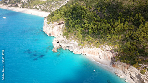 Aerial drone photo of iconic paradise beach of Kathisma with white rock steep cliff and emerald clear sea, Lefkada island, Ionian, Greece © aerial-drone