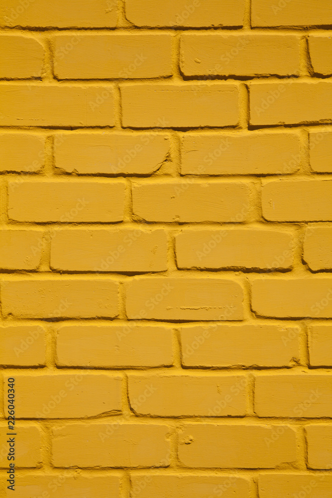 texture of a yellow brick wall as a
