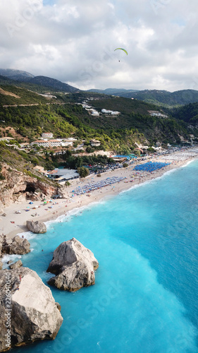 Fototapeta Naklejka Na Ścianę i Meble -  Aerial drone photo of iconic paradise beach of Kathisma with white rock steep cliff and emerald clear sea, Lefkada island, Ionian, Greece