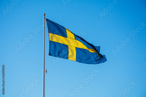 Sweden flag, country symbol on blue sky background