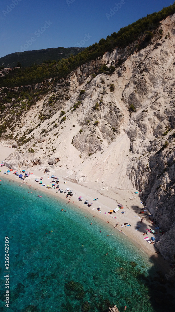 Aerial drone bird's eye view photo of small rocky beach next to iconic beach of Milos and Agios Nikitas in island of Lefkada, Ionian, Greece