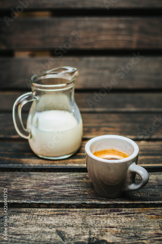 Aroma coffee cup with roasted beans on vintage old background