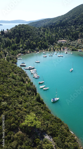 Aerial drone bird's eye view photo of iconic port of Nidri or Nydri a safe harbor for sail boats and famous for trips to Meganisi, Skorpios and other Ionian islands, Leflkada island, Ionian, Greece