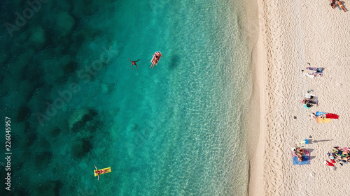 Aerial drone photo of popular tropical paradise deep turquoise beach of Porto Katsiki with white steep rocky seascape and beautiful cloudy landscape, Lefkada island, Ionian, Greece