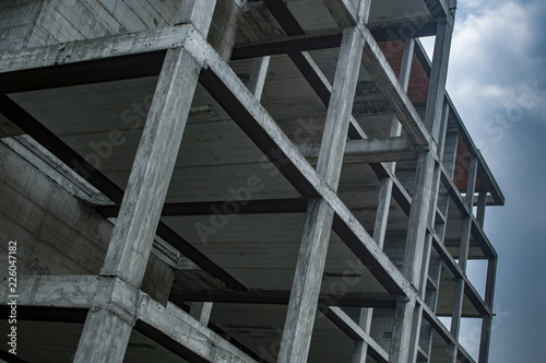 Quadro em tela construction site, reinforced concrete structure on cloudy sky background