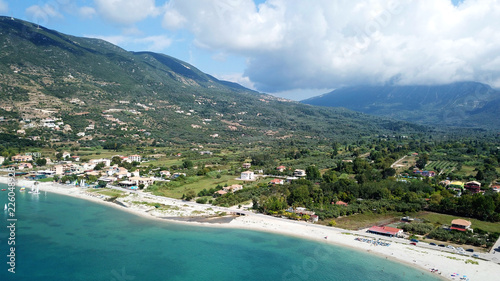Aerial drone photo of famous seaside village and port of Vasiliki famous for trips to Ionian islands and nearby beaches, Lefkada, Greece © aerial-drone