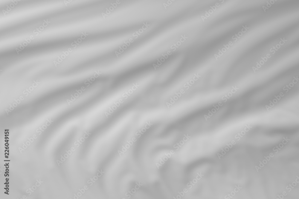 Fototapeta premium folded orange material texture with blurred focus - abstract photo background for use as background.