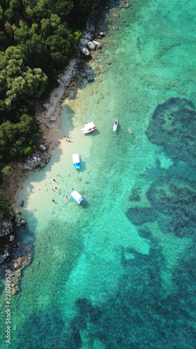 Aerial drone bird's eye view photo of famous sandy beach and small island of Agia Paraskevi with emerald clear sea, Thesprotia, Epirus, Greece