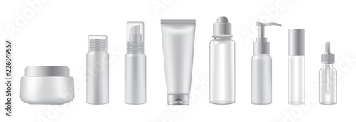 Set of cosmetic bottles on white background