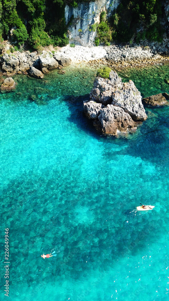 Aerial drone bird's eye view photo of famous sandy beach and small island of Agia Paraskevi with emerald clear sea, Thesprotia, Epirus, Greece