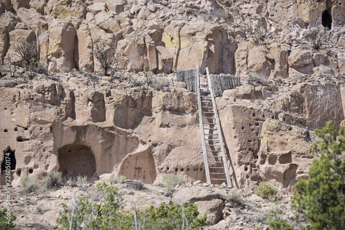 Photography Puye Cliff Dwellings with traditional wooden ladder are runes where ancient pueb
