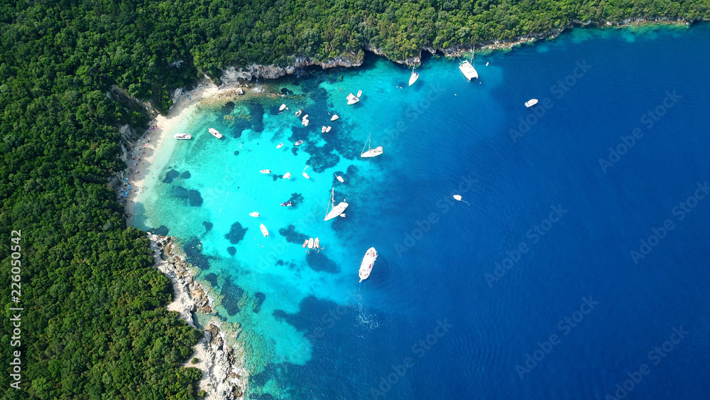 Aerial drone bird's eye view photo of iconic paradise sandy beach of blue lagoon with deep turquoise clear sea and pine trees  in complex island of Mourtos in Sivota area, Epirus, Greece - obrazy, fototapety, plakaty 