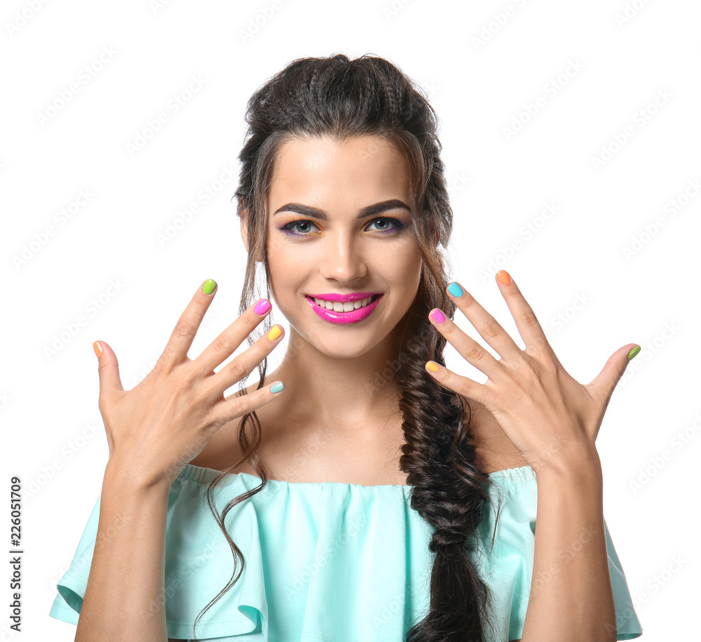Beautiful young woman with colorful manicure on white background Beautiful young woman with colorful manicure on white background