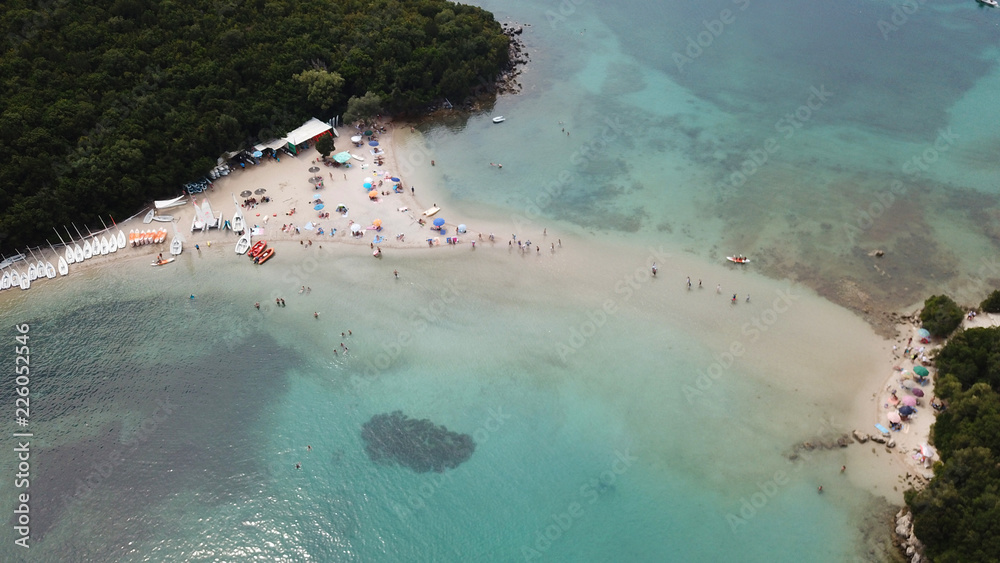 Aerial drone bird's eye view photo of iconic paradise sandy beaches with turquoise sea in complex islands of Agios Nikolaos and Mourtos in Sivota area, Ionian sea, Epirus, Greece