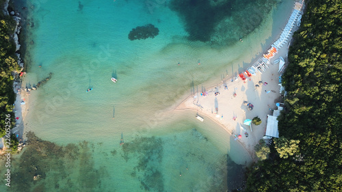 Aerial drone bird's eye view photo of iconic paradise sandy beaches with turquoise sea in complex islands of Agios Nikolaos and Mourtos in Sivota area, Ionian sea, Epirus, Greece