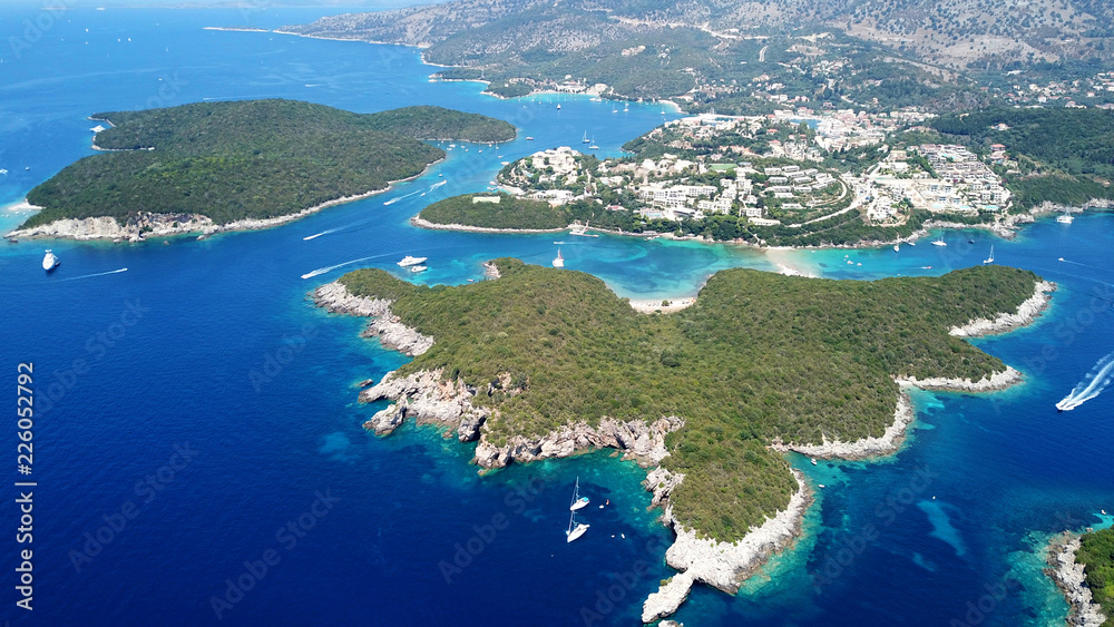 Aerial drone bird's eye view photo of iconic paradise sandy beaches with turquoise sea in complex islands of Agios Nikolaos and Mourtos in Sivota area, Ionian sea, Epirus, Greece