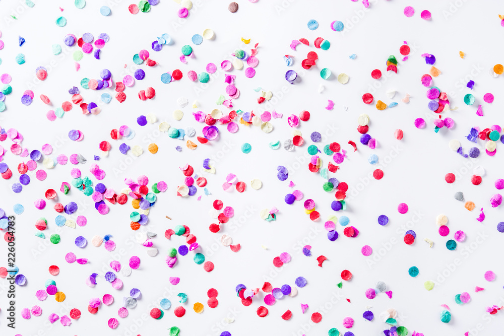 Party background. Party colorful confetti on white background. Top view. 