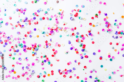 Party background. Party colorful confetti on white background. Top view. 