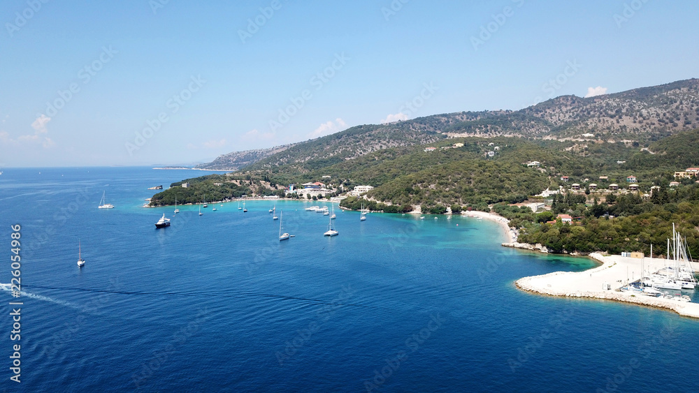 Aerial drone bird's eye view photo of iconic paradise sandy beaches with turquoise sea in complex islands of Agios Nikolaos and Mourtos in Sivota area, Ionian sea, Epirus, Greece