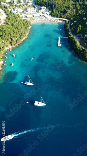 Fototapeta Naklejka Na Ścianę i Meble -  Aerial drone bird's eye view photo of iconic paradise sandy beaches with turquoise sea in complex islands of Agios Nikolaos and Mourtos in Sivota area, Ionian sea, Epirus, Greece