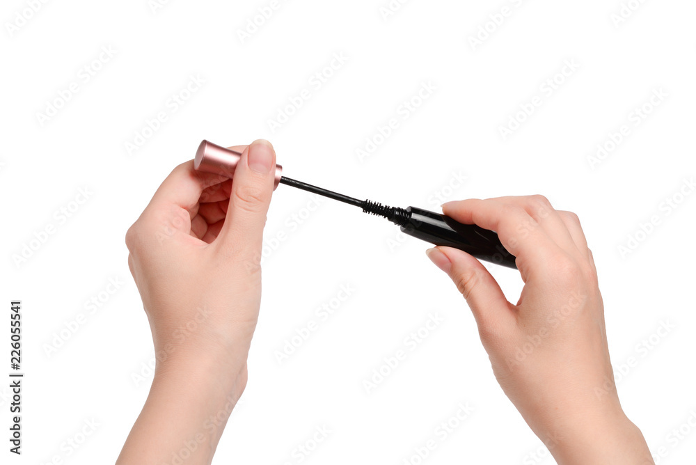 Mascara in woman hand. Isolated on white background Mascara in woman hand. Isolated on white background