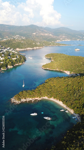 Aerial drone bird's eye view photo of iconic paradise sandy beaches with turquoise sea in complex islands of Agios Nikolaos and Mourtos in Sivota area, Ionian sea, Epirus, Greece © aerial-drone