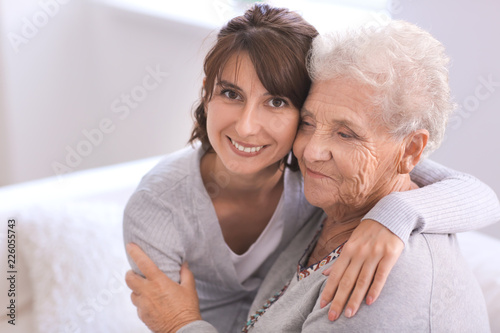 Happy elderly woman with he...