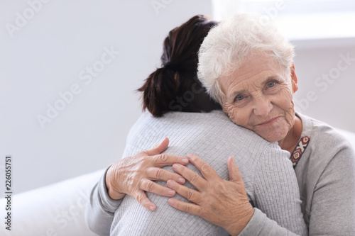 Happy elderly woman with he...