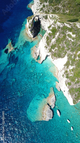 Aerial drone bird's eye view photo of tropical rocky arch with turquoise clear waters in iconic island of Paxos, Ionian, Greece