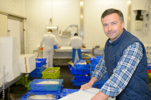 Photography Worker in fish processing plant